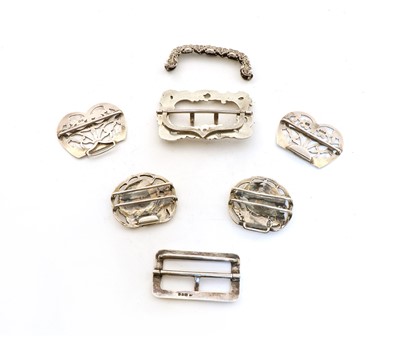 Lot 64 - A collection of four silver belt buckles