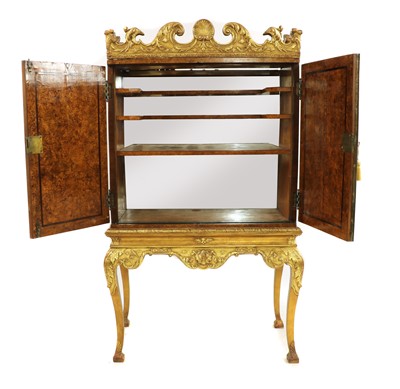 Lot 300 - A reproduction cabinet on giltwood stand
