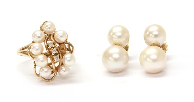 Lot 1311 - A gold pearl and diamond cluster ring