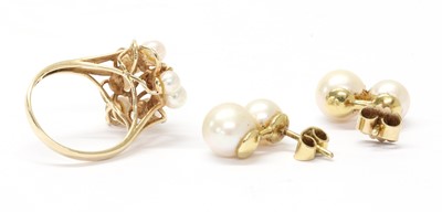 Lot 1311 - A gold pearl and diamond cluster ring
