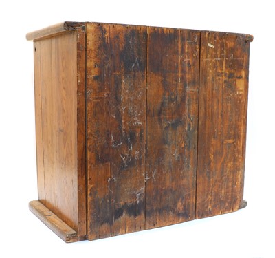 Lot 250 - A pitch pine and oak collector’s cabinet