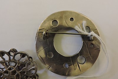 Lot 80 - A silver Arts & Crafts moonstone circle brooch