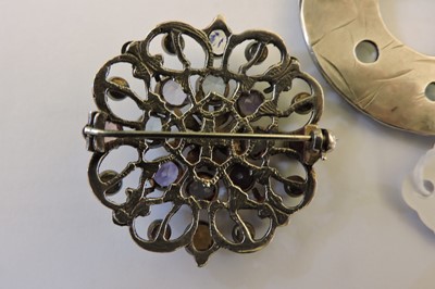 Lot 80 - A silver Arts & Crafts moonstone circle brooch