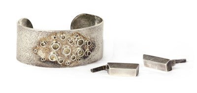 Lot 1062 - A handmade sterling silver torque bangle