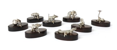 Lot 1318 - A set of eight silver animal place card holders, by Patrick Mavros