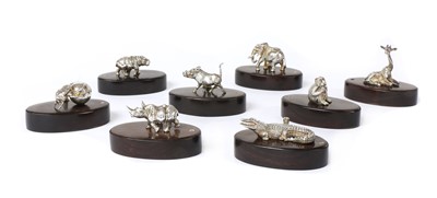 Lot 1318 - A set of eight silver animal place card holders, by Patrick Mavros