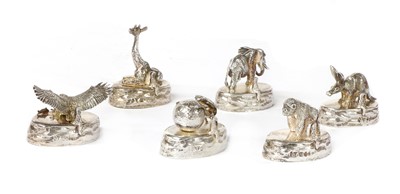 Lot 1319 - A set of six solid animal silver place card holders, by Patrick Mavros