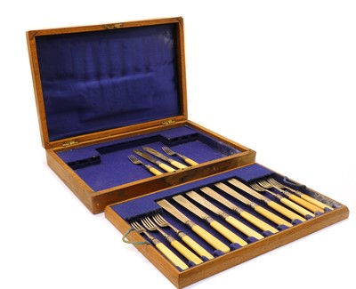 Lot 3 - An oak cased set of eight fish knives and forks
