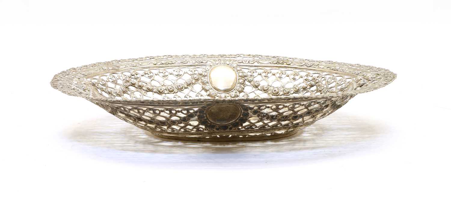 Lot 4 - A German silver basket, with pierced, pressed and repousse decoration