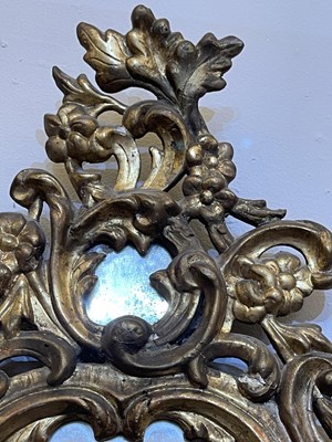 Lot 80 - A pair of rococo wall mirrors
