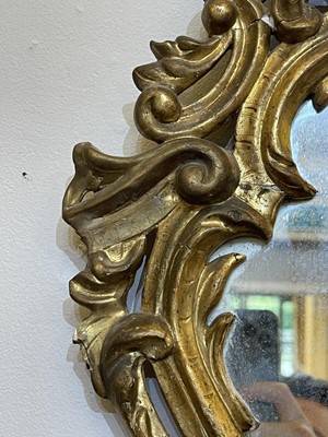 Lot 80 - A pair of rococo wall mirrors