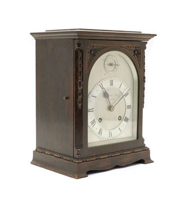 Lot 159 - An oak mantel clock
