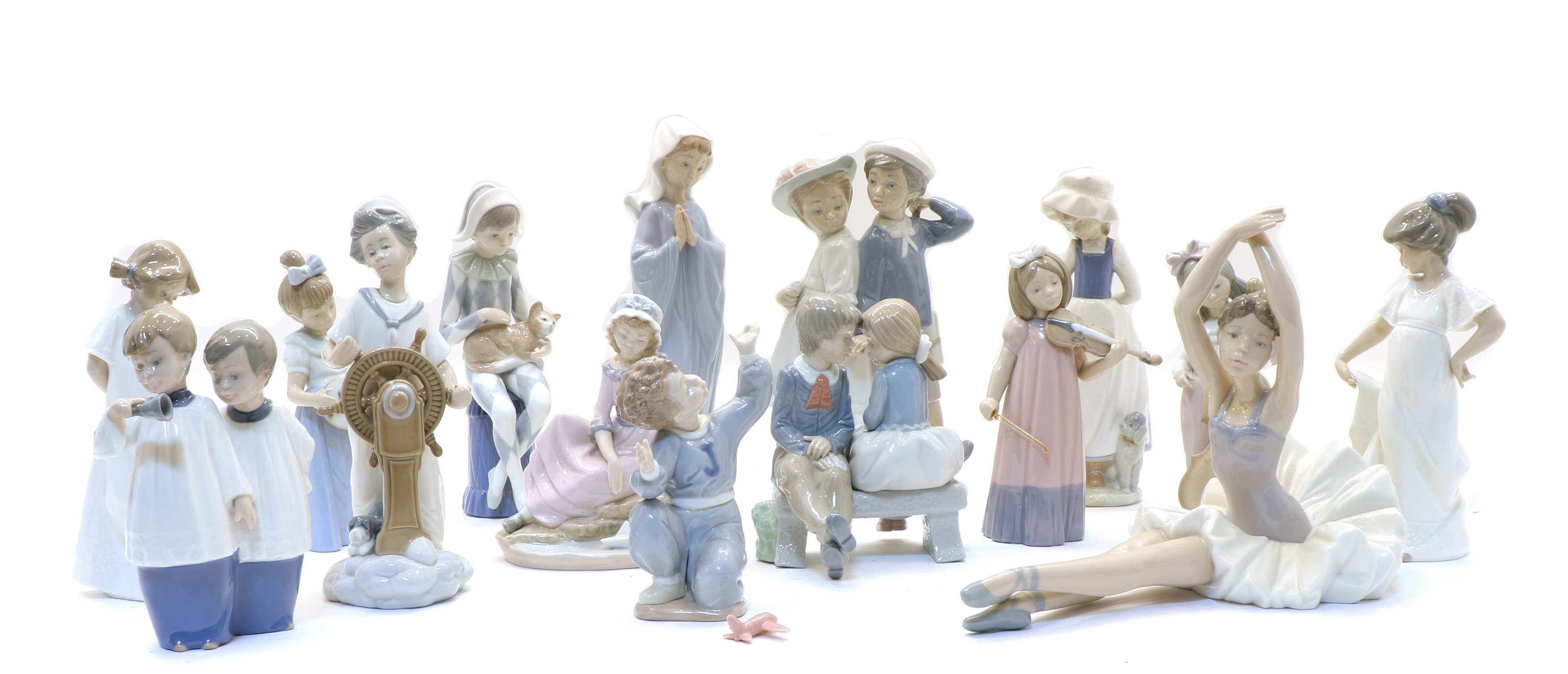 Lot 183 A collection of Nao porcelain figures,