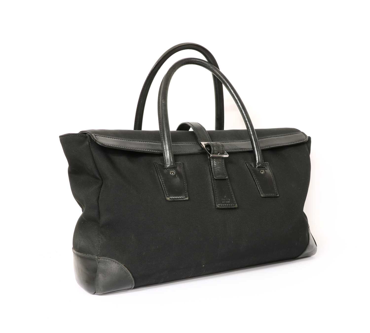 Lot 1371 - A Gucci black nylon and leather weekend bag,