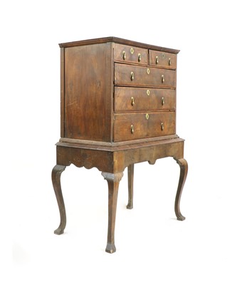 Lot 324 - An early 18th century walnut chest on stand
