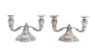 Lot 31 - A pair of Continental silver dwarf twin branch candelabra