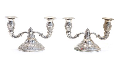 Lot 31 - A pair of Continental silver dwarf twin branch candelabra