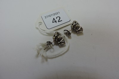 Lot 42 - A pair of two stone diamond stud earrings