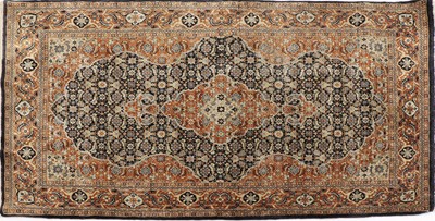 Lot 351 - A small Chinese silk rug
