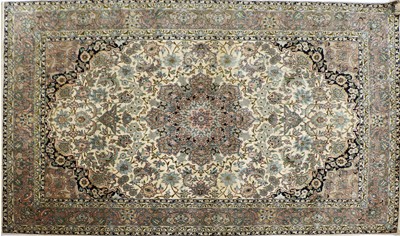 Lot 379 - A Persian silk rug