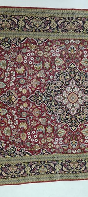 Lot 392 - A Persian silk rug