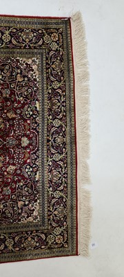 Lot 392 - A Persian silk rug