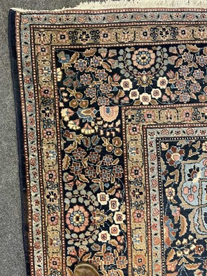 Lot 293 - A large Persian Mashad carpet