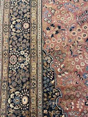 Lot 293 - A large Persian Mashad carpet