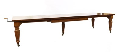 Lot 262 - A large late Victorian walnut wind-out dining table