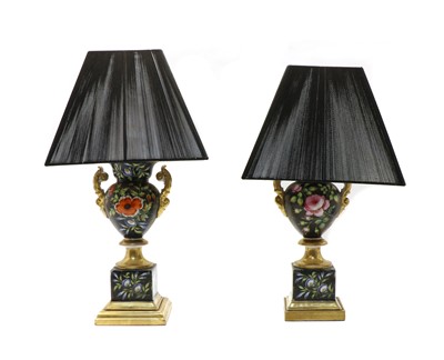 Lot 129 - A pair of pottery urn table lamps