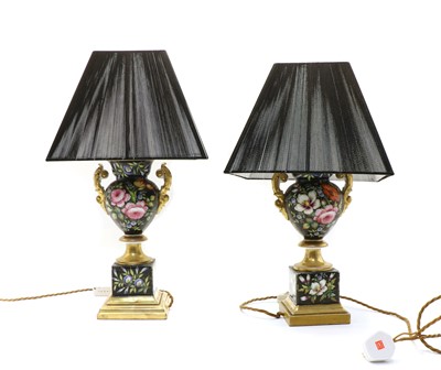 Lot 129 - A pair of pottery urn table lamps