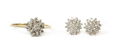 Lot 1188 - A pair of 18ct gold diamond cluster earrings