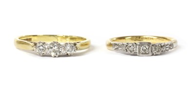 Lot 1189 - An 18ct gold three stone diamond ring