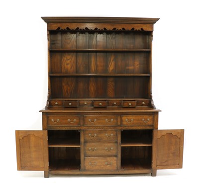 Lot 288 - A George III style oak dresser