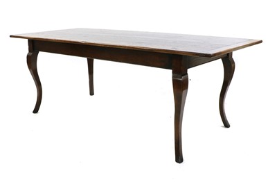 Lot 286 - An oak dining table