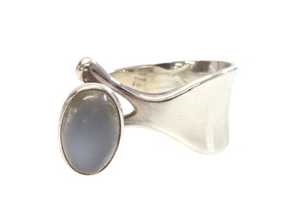 Lot 411 - A sterling silver single stone moonstone ring, by Georg Jensen