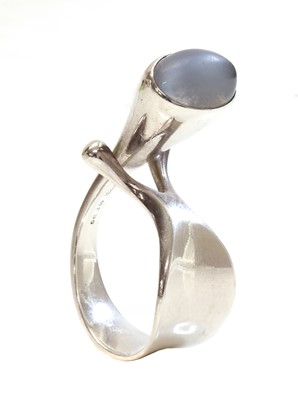 Lot 411 - A sterling silver single stone moonstone ring, by Georg Jensen