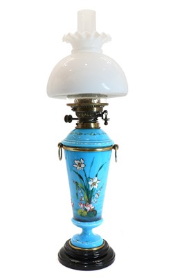 Lot 131 - A blue glass oil lamp