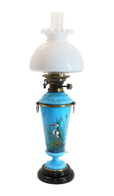 Lot 131 - A blue glass oil lamp