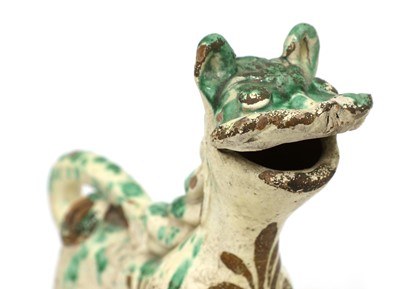 Lot 515 - A Turkish pottery aquamanile in the form of a lion