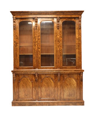 Lot 389 - A Victorian burr walnut triple bookcase