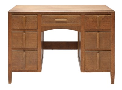 Lot 90 - A Cotswold School oak kneehole desk