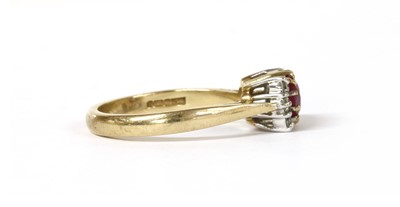Lot 1218 - A 9ct gold ruby and diamond ring