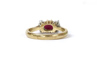 Lot 1218 - A 9ct gold ruby and diamond ring