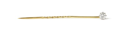 Lot 1173 - A gold single stone diamond stick pin