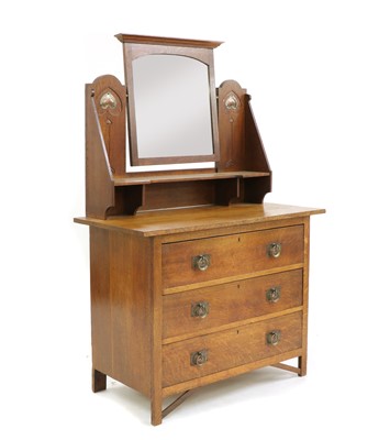 Lot 572 - An Arts & Crafts oak dressing chest