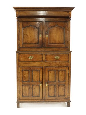 Lot 280 - An 18th century oak court cupboard