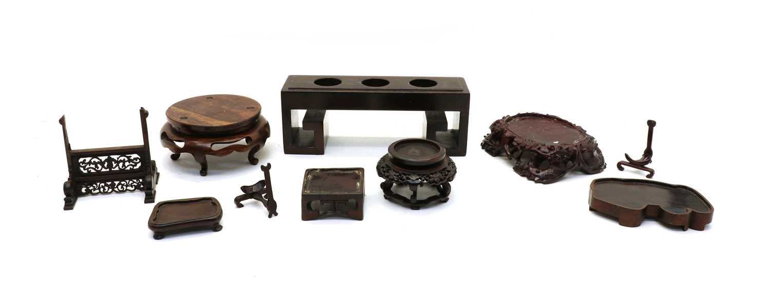 Lot 91 - A collection of Chinese wood stands