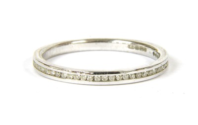 Lot 1206 - A 9ct white gold diamond set half eternity ring