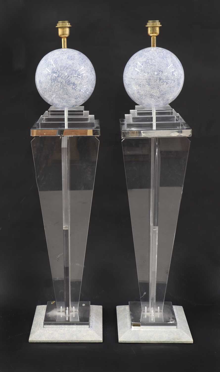 Lot 641 - A pair of Lucite lamps